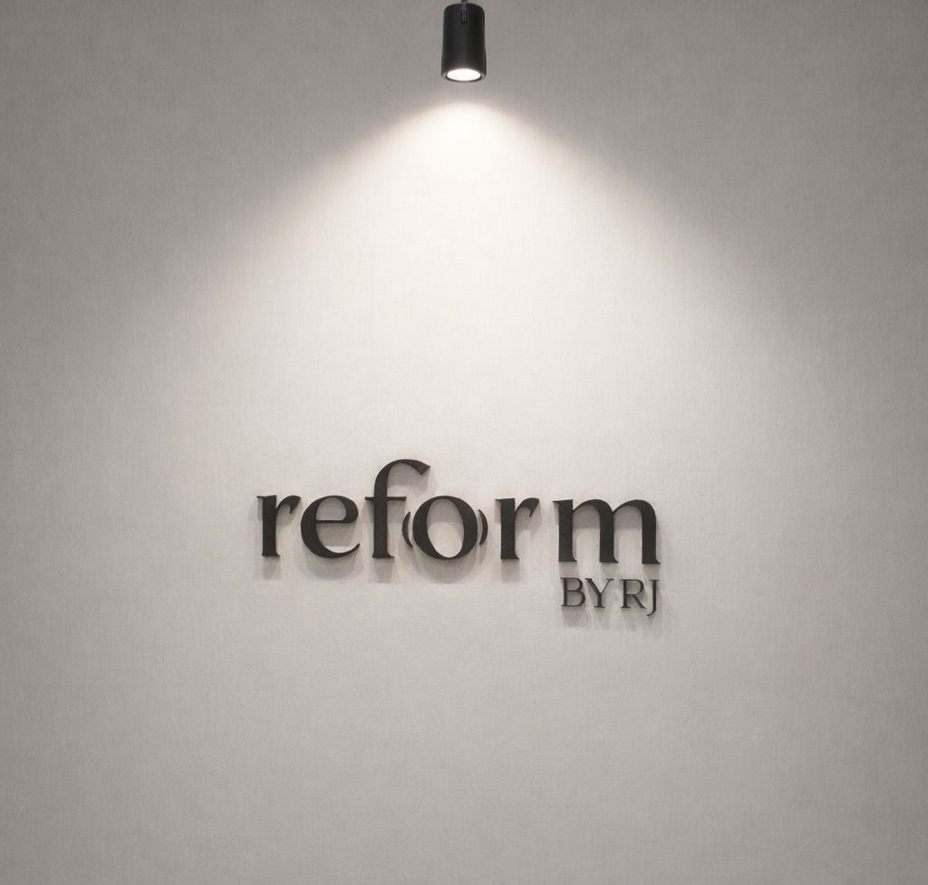 Reform by RJ signage on the studio wall