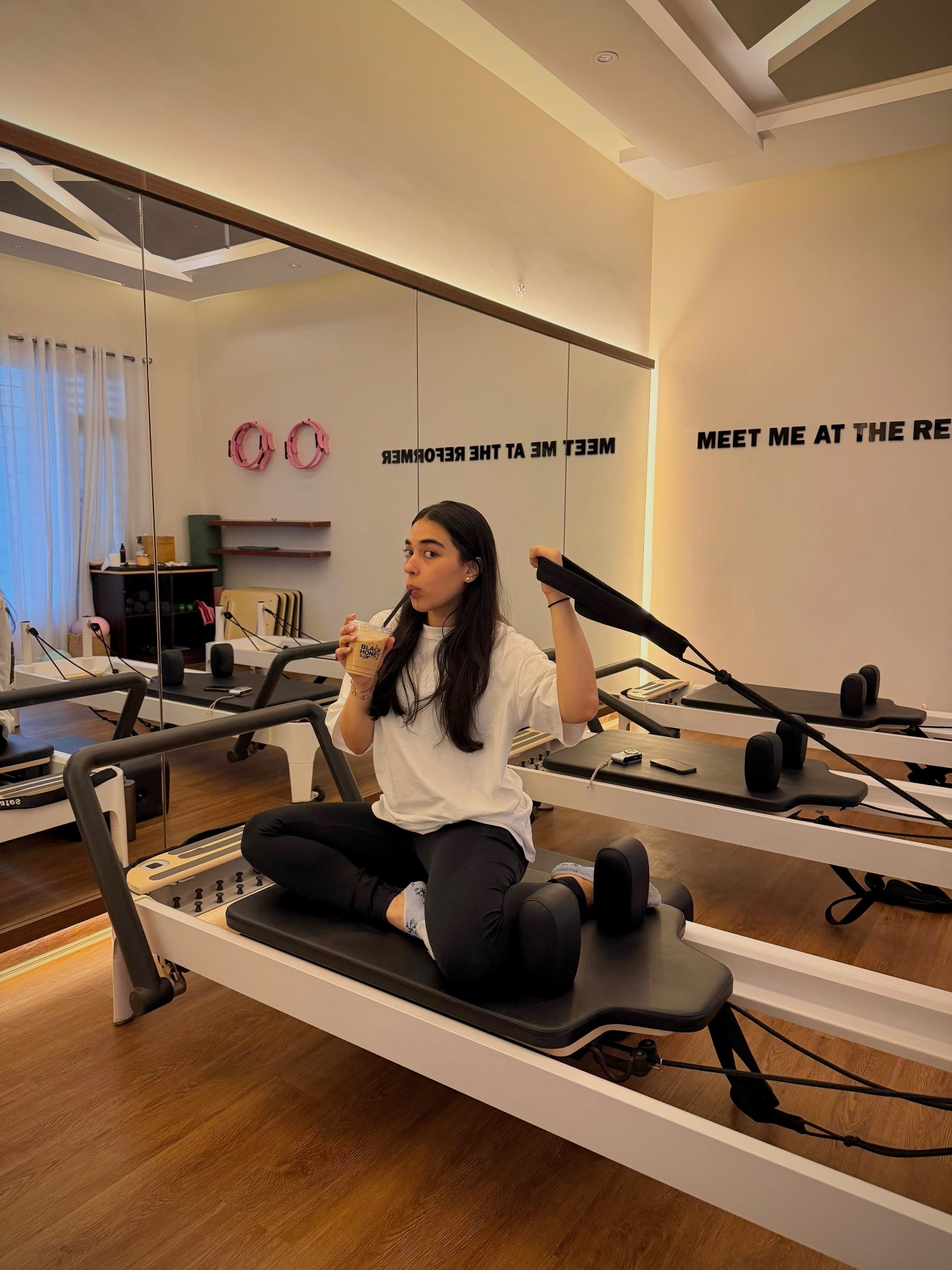 Taking a break on a reformer at the studio